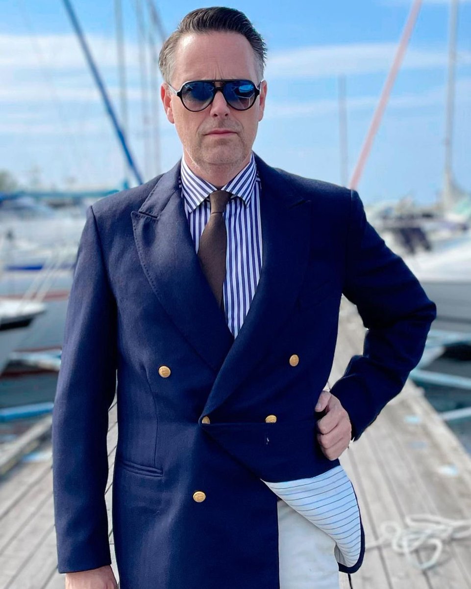 Classic maritime look with navy blazer stripped shirt and white pants. A little higher grade of formality makes it excellent outfit for socializing at the boat club, dinner at a sea side restaurant or a cocktail on the boat.