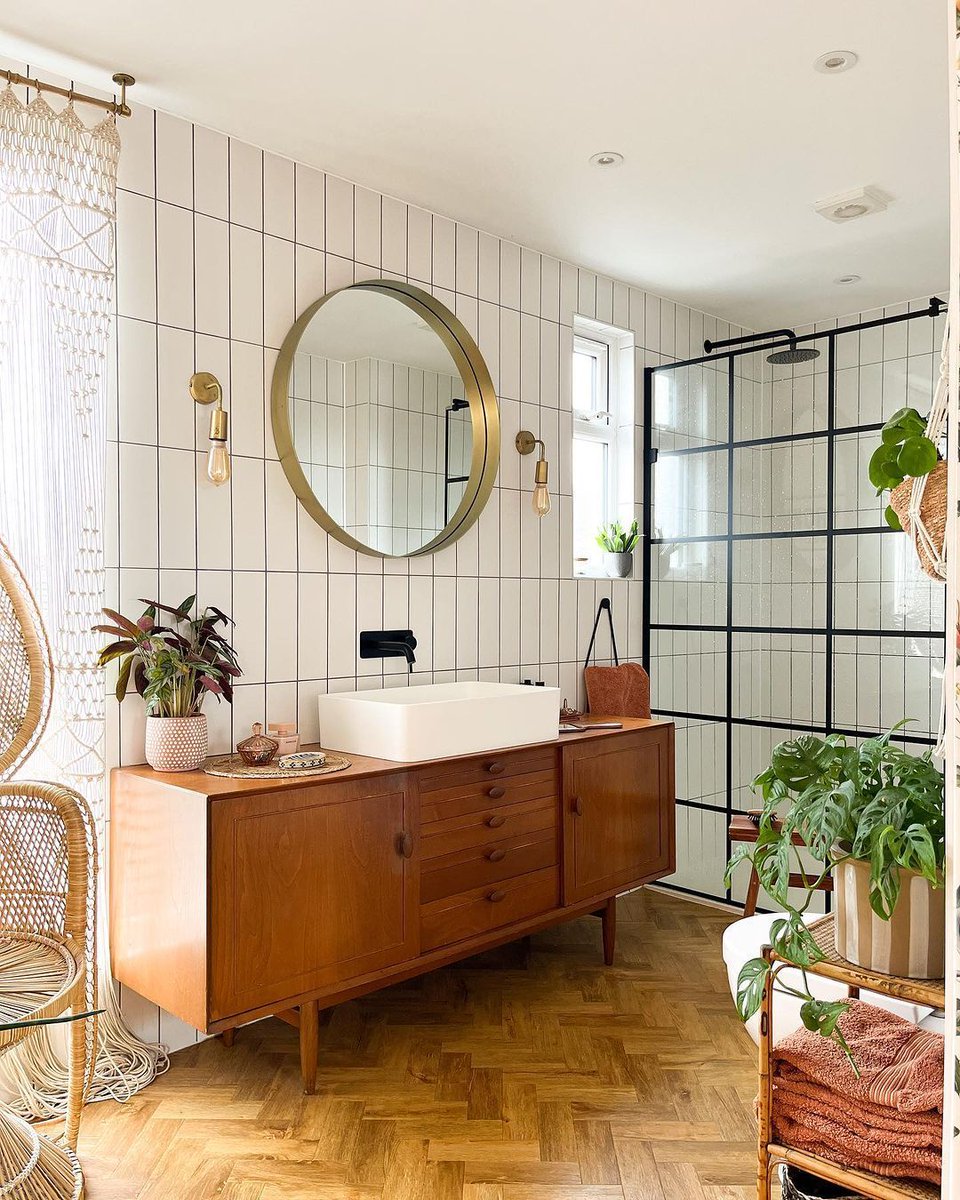 Re-vamp your bathroom space with the sleek sophistication of our Liberty Black Grid Pattern Wetroom Panel. @leopard_print_stairs on Instagram creates bohemian chic with a combination of elements of nature with this urban, grid industrial-style glass | buff.ly/3dJ4JTS