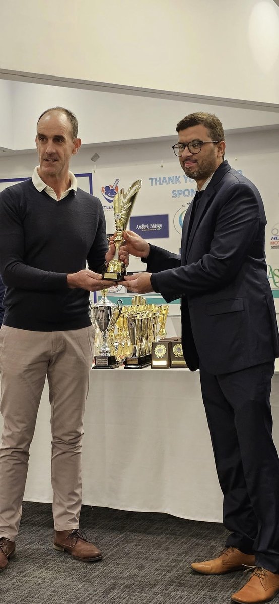 Brian O'Rourke giving Player of the Club award to Masrat Naveed Aslam at Castleknock Cricket Club Annual Award Function 2023 at Darbar Restaurant Dublin 15