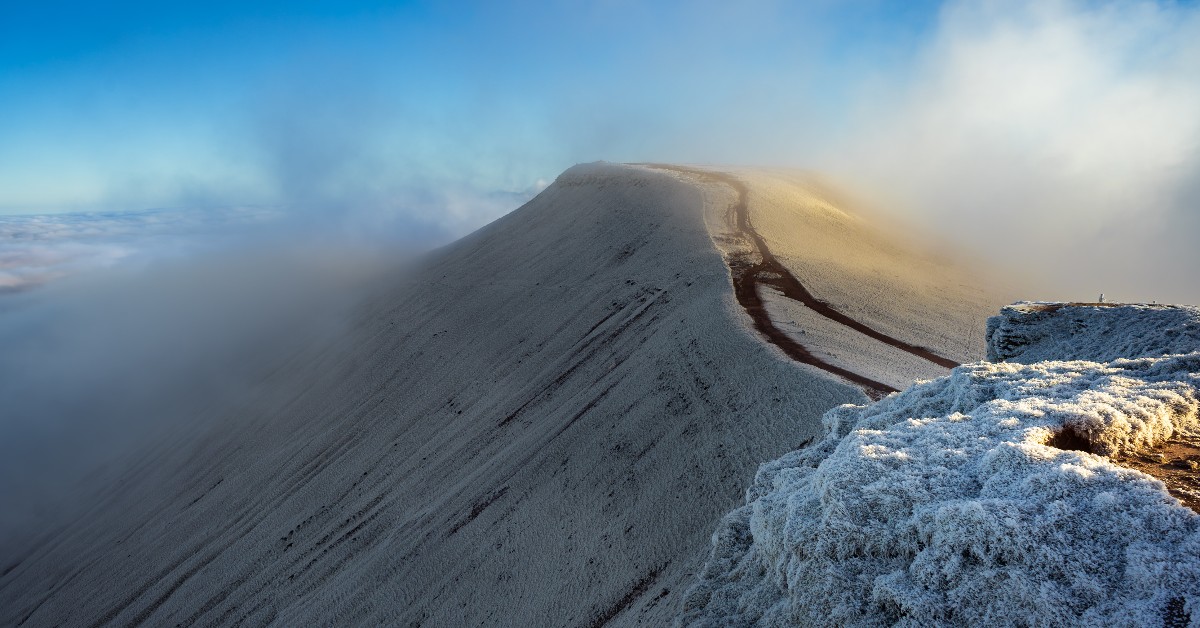 The snow covered peaks of Pen Y Fan in Wales @NTCymru can make you feel on top of the world. Get there early to grab the best views. 

Photo: Gildas Griffiths