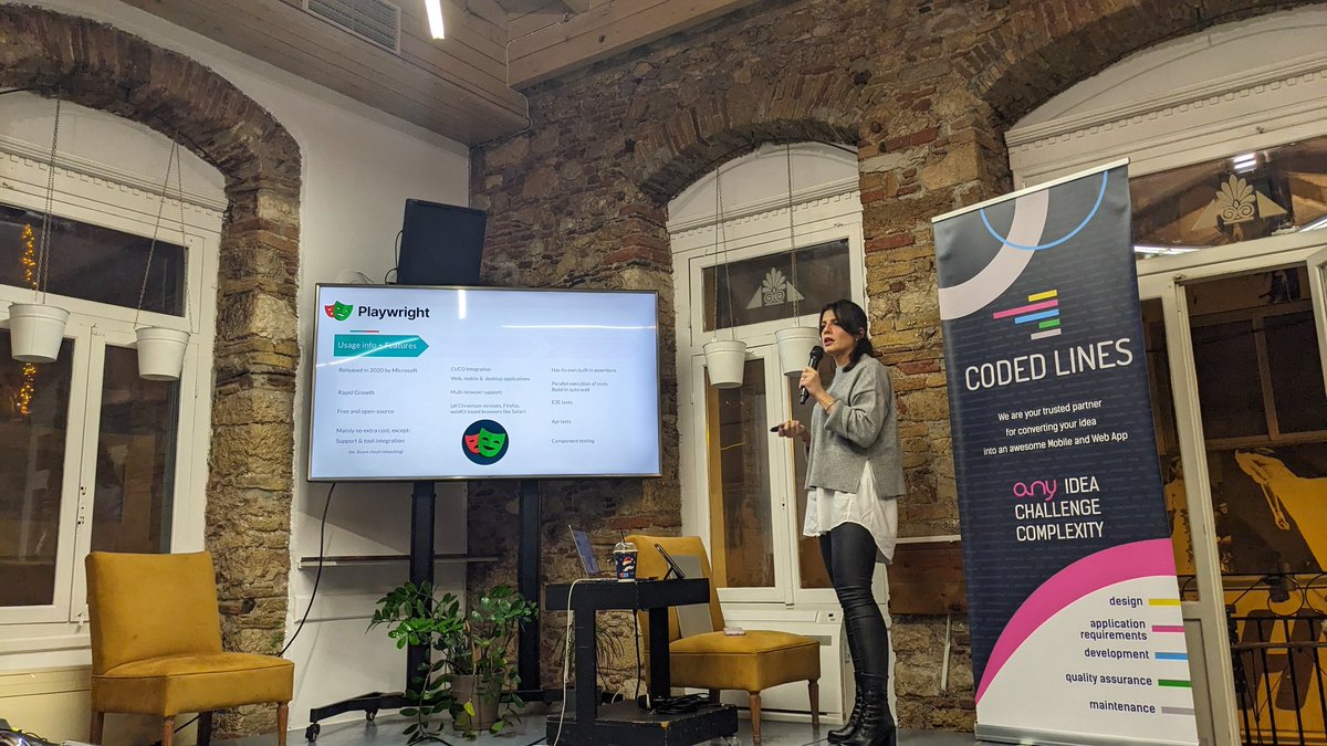 Marianna Androutsopoulou, Software Engineer in Test @ Causaly on our stage presenting '#Cypress vs. #Playwright: The battle of Testing Titans'. @greecejs #greecejs #meetup #tech #community #JavaScript #js #web #mobile #development #testing