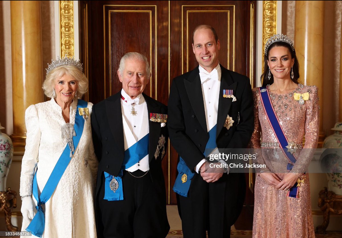Queen Camilla, King Charles III and The Prince and Princess of Wales pose for a photograph ahead of The Diplomatic Reception in the 1844 Room at Buckingham Palace tonight