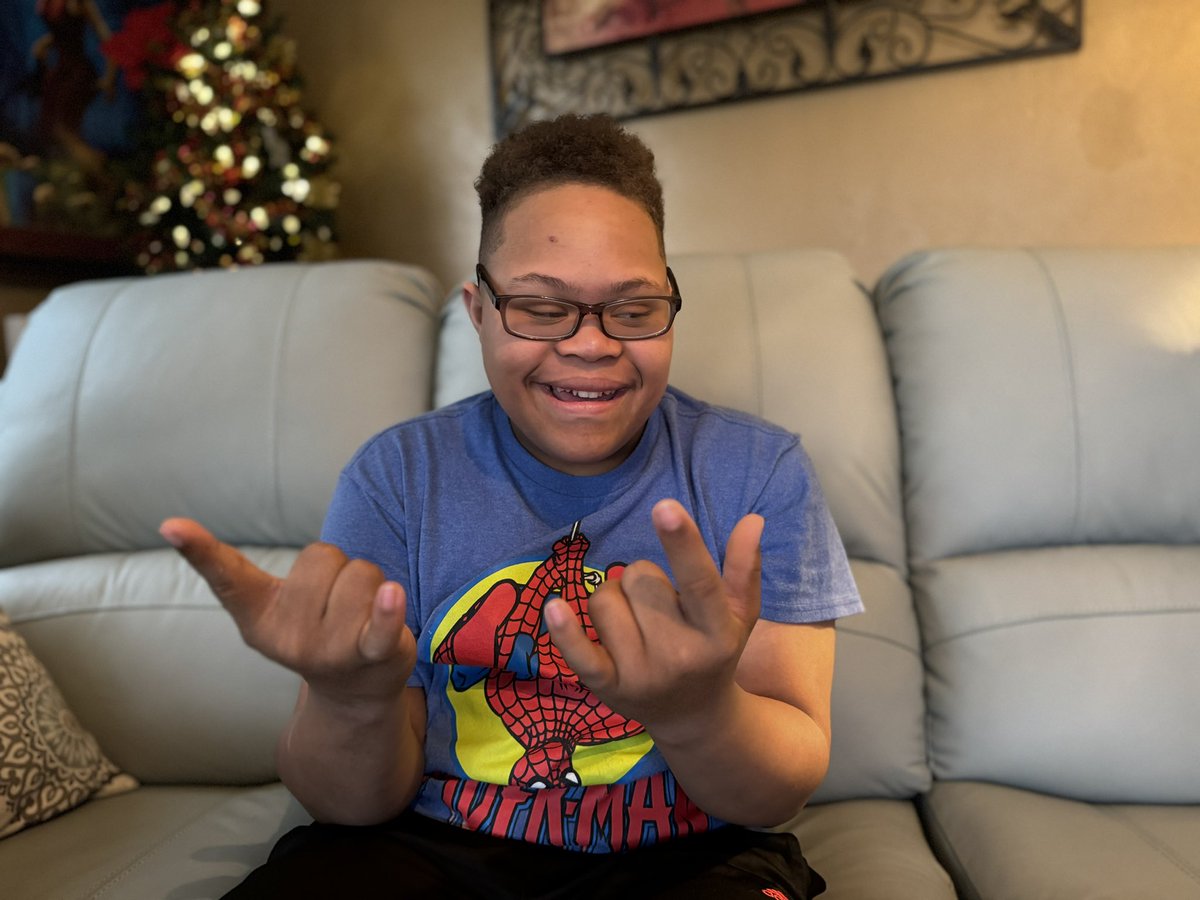 Meet our new friend Christian. It was a joy to deliver gifts to him. Christian is diagnosed with #DownSyndrome  and #autism . He was thrilled to receive the presents! Wishing a Merry Christmas to Christian.