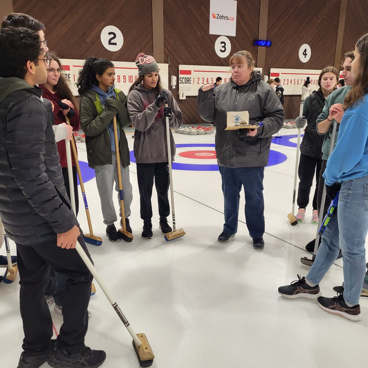 DCDSchool's tweet photo. The Honors Physics classes visited a curling club in Windsor, during a fan-favorite field trip. They were treated to an engaging lesson, enjoyed some friendly competition with their peers, and gathered valuable data for their class lab. #DCDSFun #DCDSAcademics https://t.co/lkxV4rqsaq