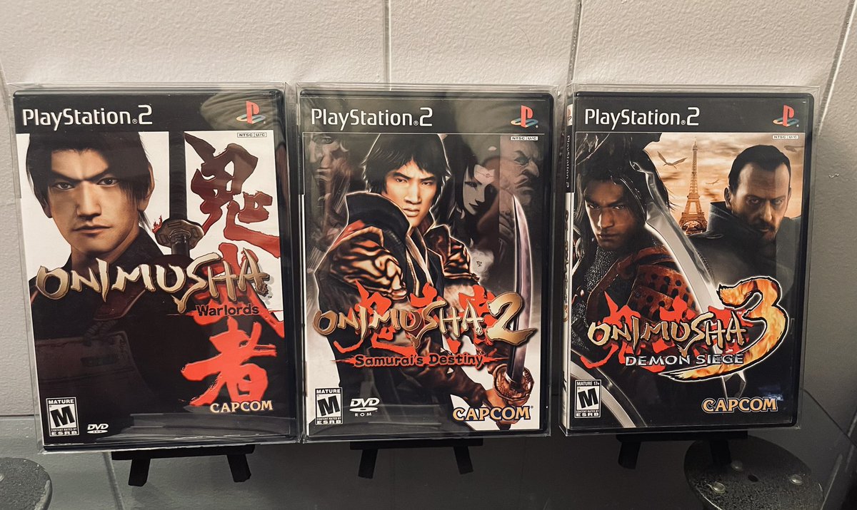 FakePearBear's tweet photo. For #TrilogyTuesday we have the AMAZING samurai epic that is Capcom’s Onimusha series. First debuting in January of 2001 on the PlayStation 2, Onimusha has seen success on various platforms for the past few decades, though many are still vouching for the original trilogy shown here to get the remake treatment with the new RE Engine from its developer.
The series takes place in feudal Japan and has you fighting fictional monsters and loads of undead samurai. Another fun fact about the game is that the first Onimusha title was the very first PlayStation 2 game to reach 1 million copies sold for the console, eventually surpassing TWO million.
All three of these are excellent additions to a collection and can be found at very fair prices between $10-$20 in CIB! Thanks for reading and see you guys next week for another one!