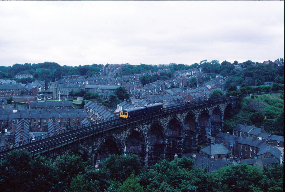 I can guarantee this is a rare photo from my deceased father in law David McMurray, a career railman. ##Durham Viaduct and a Class 100 #DMU saloon. Sometime 1984.