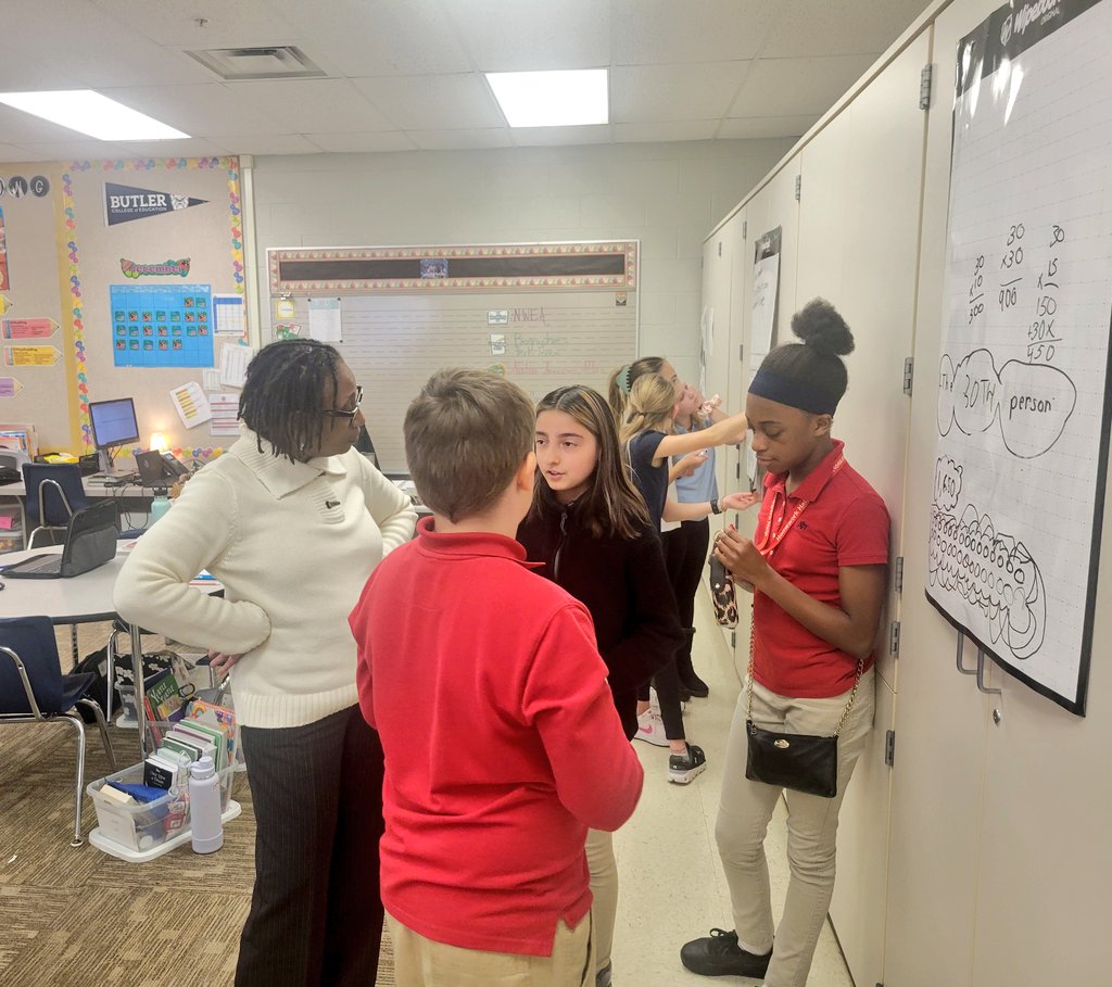 Ms. Mitchell does an amazing job pushing her students' thinking by asking questions, listening to students as they explain their thought process, and encouraging them to interrogate their answers.