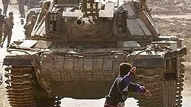 This is the famous picture of Faris Odeh, a fifteen-year-old Gazan boy killed Nov. 9, 2000, ten days after this photo. According to the NYT, 'His friends said he was shot while crouching down to pick up a stone. He was so close to an Israeli tank, they said, that they could not…