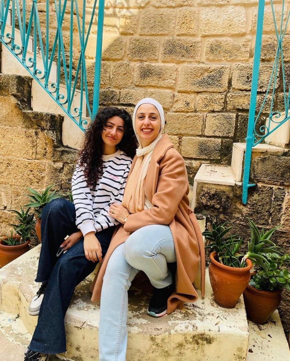 GazaMartyrs's tweet photo. The martyr Hala Saleh and her daughters Maymana and Habiba.

Hadeel Saleh, the sister of the martyr Hala who resides in Britain, says that her sister, the martyr Hala, was like everyone else in Gaza, having dreams she sought to achieve. Hala was a woman who struggled in her life, exceptional in everything, and her dreams were vast. For example, she worked in an insurance company, but she dreamed of becoming a journalist. She also wrote poetry and children's stories, starting with the idea of creating a WhatsApp group aimed at exchanging books and ideas. Hala was also known for her humanity, volunteering to read stories to children in "Champions" , the well-known resort for families in Gaza. She also recorded some passages of her favorite books with her voice.

As for her daughter, the martyr Maimuna, she adored art and studied it at university. She was looking forward to finishing her university stage to travel to America or Britain to continue her art studies there.

Regarding the second daughter, the martyr Habiba, she was full of joy and talented in crafting handmade accessories. Habiba had a strong personality and dreamt of becoming a lawyer in the future.

Hala, Maimuna, and Habiba were martyred in an Israeli airstrike on their home on 25/10/2023, and with their martyrdom, their high aspirations and dreams also died.