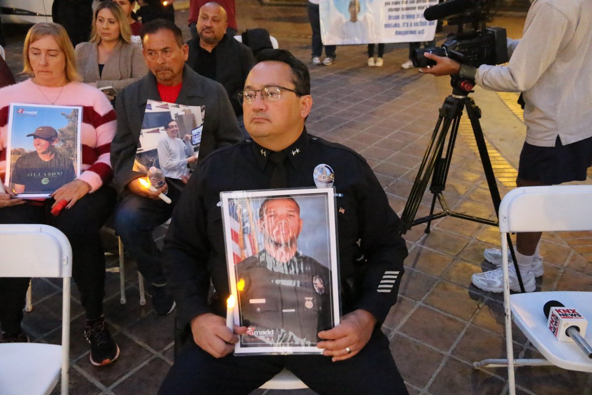 knxpete's tweet photo. #NoMoreVictims MADD joins with police, LA city leaders, CHP in a vigil and a campaign to drive down fatalities from DUI drivers during holiday. Buildings in State will be lit up in red to commemorate victims . @knxnews https://t.co/zTu2t4xbnG
