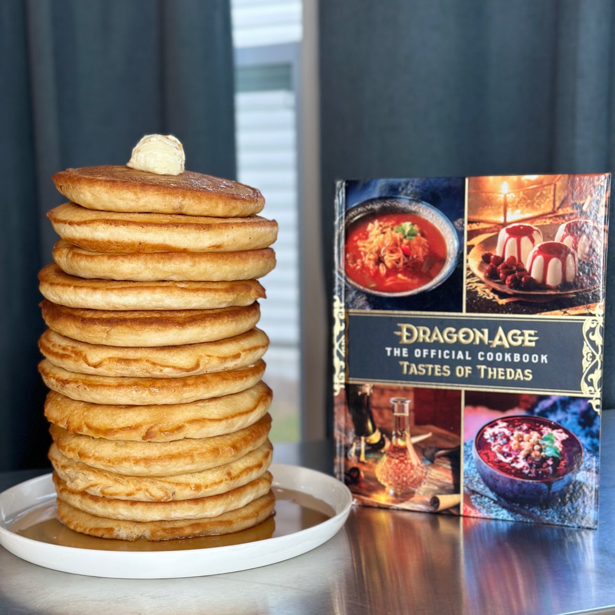 Hey Dragon Age fans, how many pancakes tall is the official cookbook?