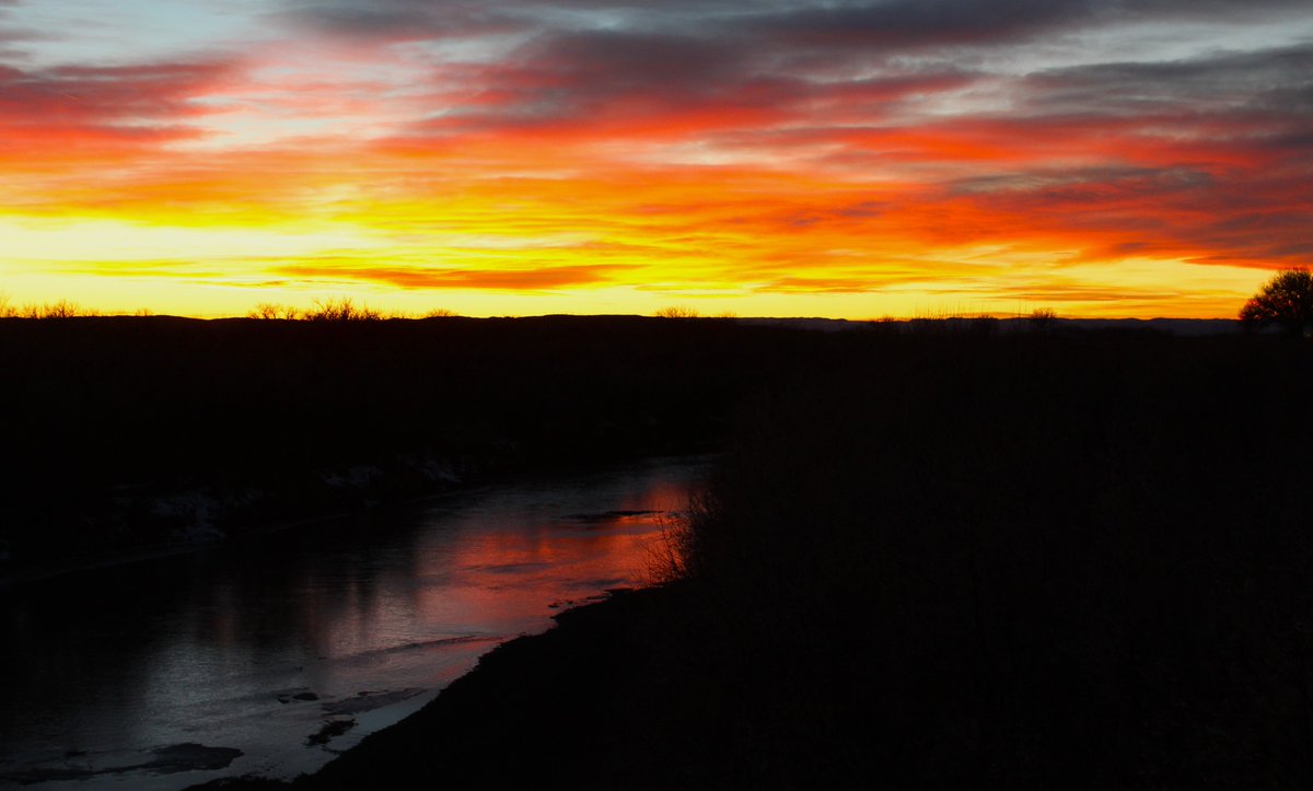 December blesses us with amazing sunsets. Here is our namesake river, with the sky ablaze. #SunsetViews #powderriverbasin #prairievibes