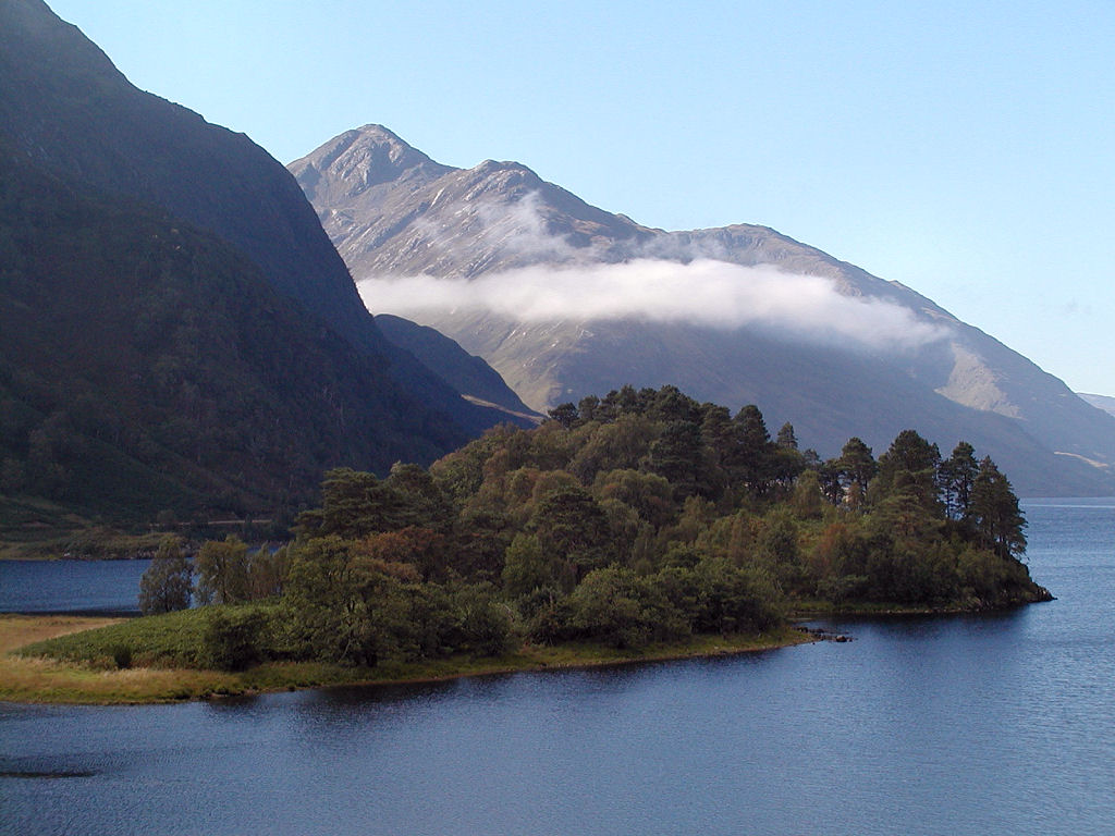 The view along Loch Shiel from above its head at Glenfinnan in Lochaber, showing the mountains on its south-east shore and Eilean Ghleann Fhionainn. It was at Glenfinnan that Bonnie Prince Charlie raised his standard in August 1745. More pics and info: undiscoveredscotland.co.uk/glenfinnan/gle…