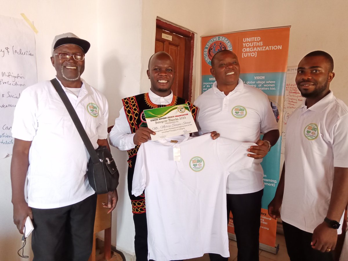 Melvin Songwe, Programs Manager of UYO receives  Integrity Award presented by Ethical Reform Society Organization, as they launch celebrations of this year's International Anti Corruption Day. This, in respect to his exceptional management of projects in the crisis hit regions.