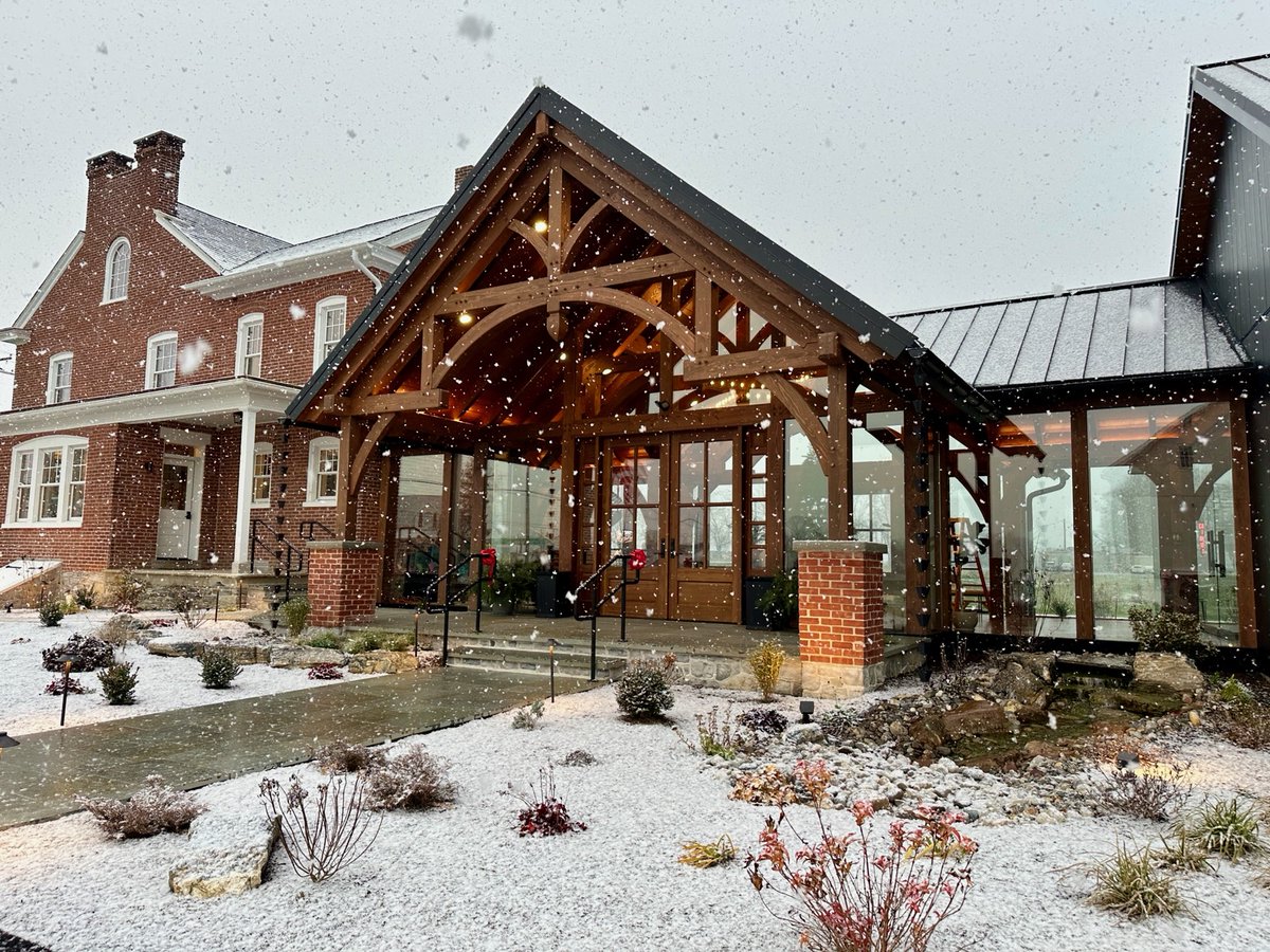 Even in the cold snow, a grand timber frame entrance provides a warm welcome!
#timberframe #timberframing