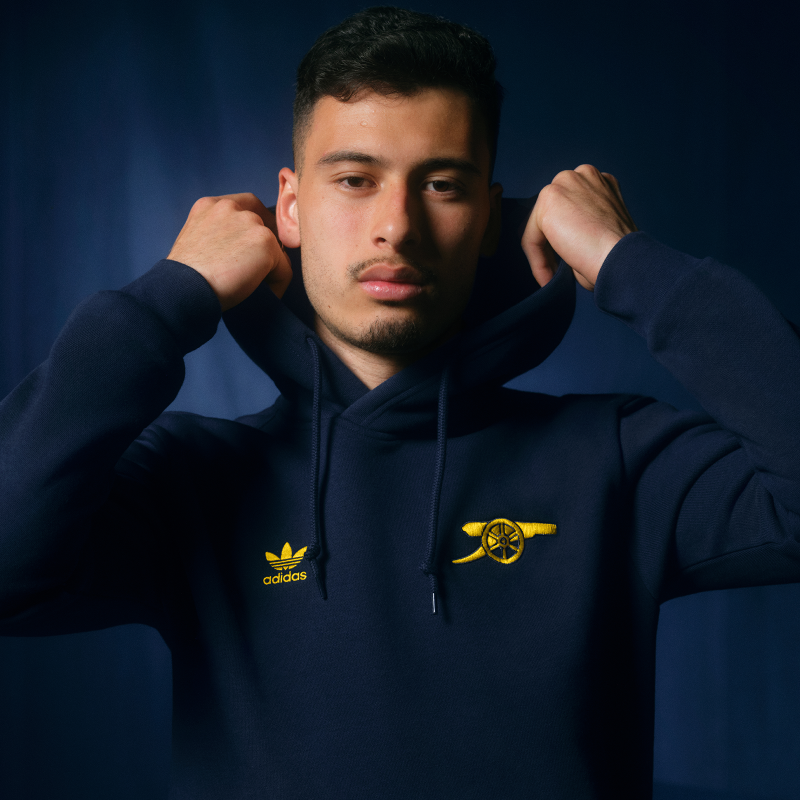 Arsenal's tweet photo. Introducing the new Originals Essentials Collection 🔥

Combining Arsenal heritage with adidas class - shop now on Arsenal Direct👇

🤝 @adidasfootball