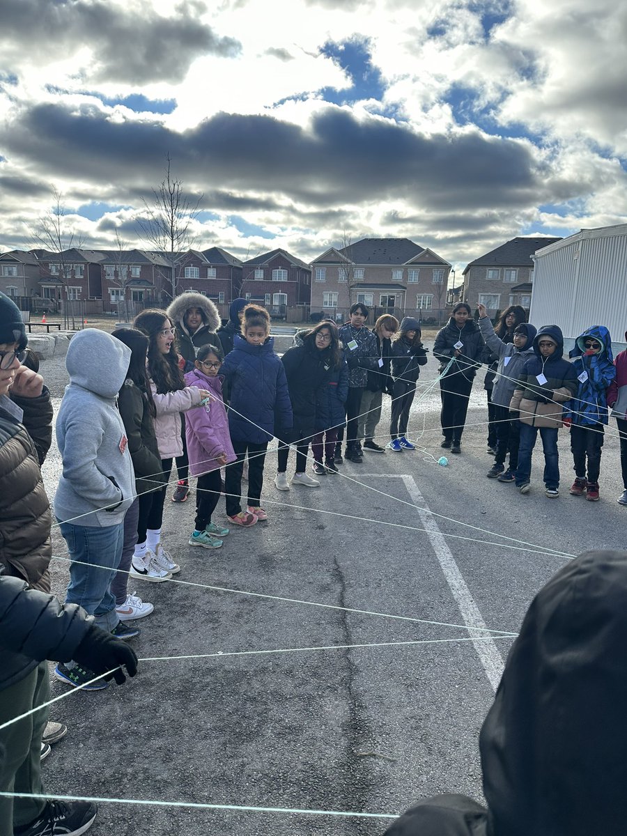 GalloDilara's tweet photo. Grade 6-2 and 5/6-1 collaborated in an activity, crafting a web to illustrate how interconnections among organisms support the coexistence of diverse plants and animals. This highlighted the dependence different species have on one another. https://t.co/nTYZdA6Zvk