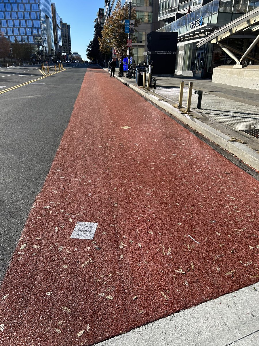 Whatever your opinion on the new M Street SE bus lanes, I’m sure we can all agree the paving was an unmitigated disaster. THE ENTIRE STRETCH of street looks like this - leaves and papers forever encapsulated. How does this level of carelessness happen, <a href="/DDOTDC/">DDOT DC</a>?