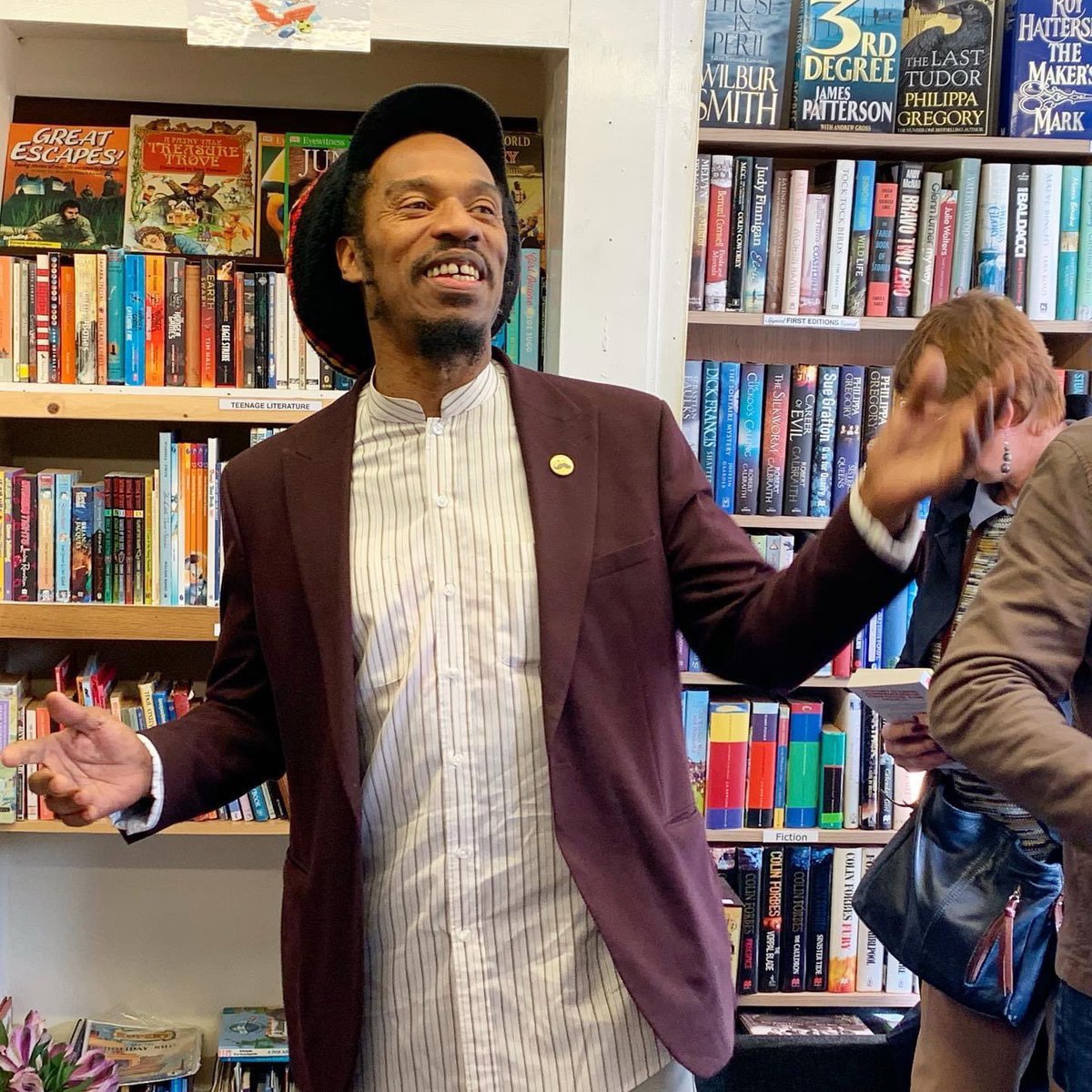 Very sad to hear about the death of Benjamin Zephaniah. He lived nearby and was well-loved  in the community. I took this photo of him reciting a poem at the opening of a tiny charity bookshop in Holbeach, Lincolnshire. Condolences to his family #BenjaminZephaniah