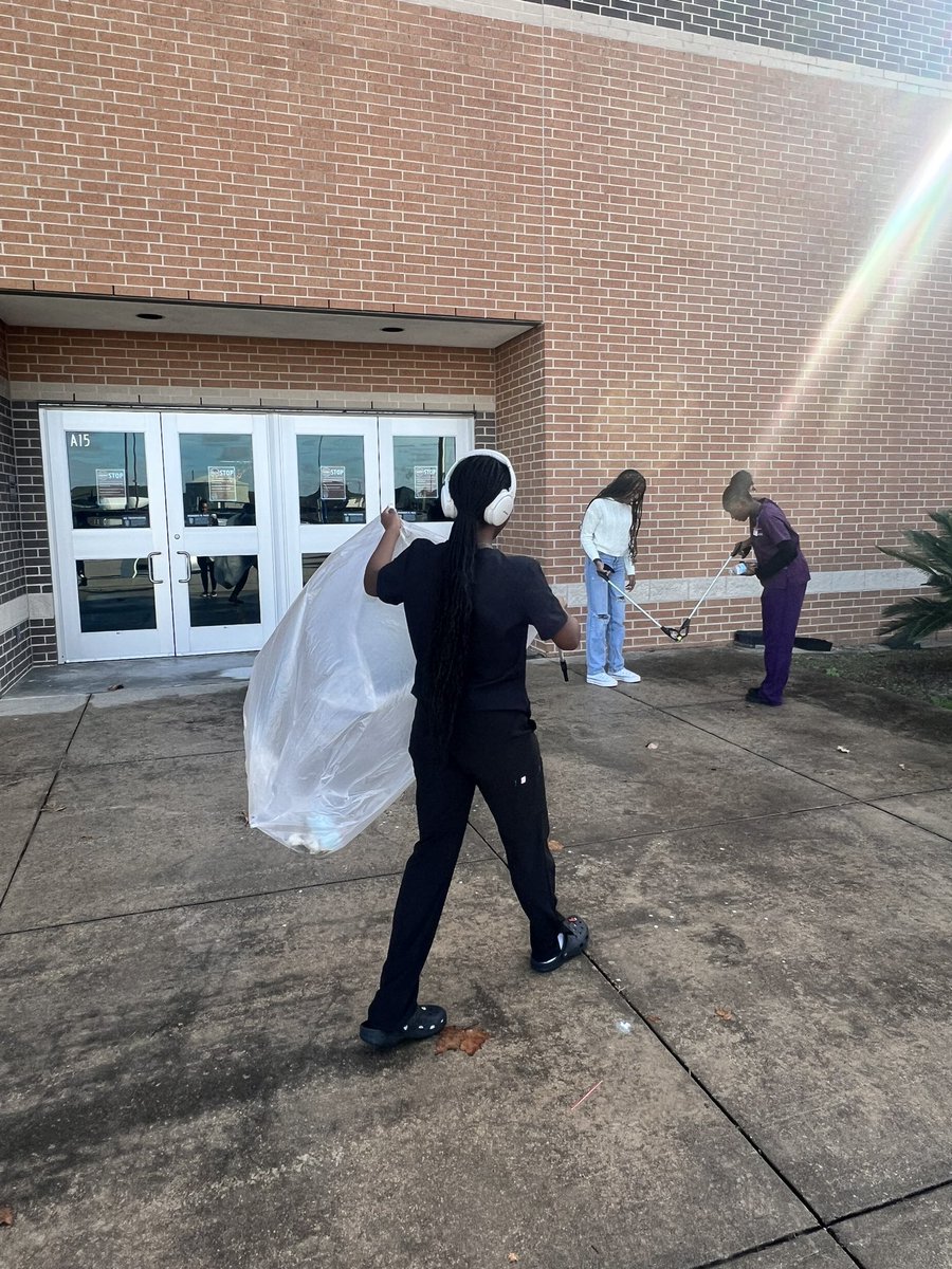 Keeping our school beautiful by picking up one piece of trash at a time!