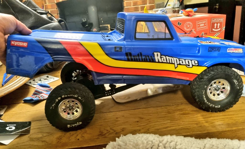 I've fancied a solid axle trophy truck for a while, so couldn't resist this cheap Kyosho Outlaw Rampage. Dodgy wing and sharp homebrew skidplate removed, wiring tidied, front shocks rebuilt and rear shocks adjusted for more travel.