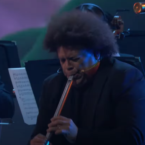 SongbirdN7's tweet photo. Flute Guy (Pedro Eustache) as the final boss of a video game. He has 3 phases and his contrabass flute does massive AOE damage #TheGameAwards https://t.co/nFGLLyOjsh