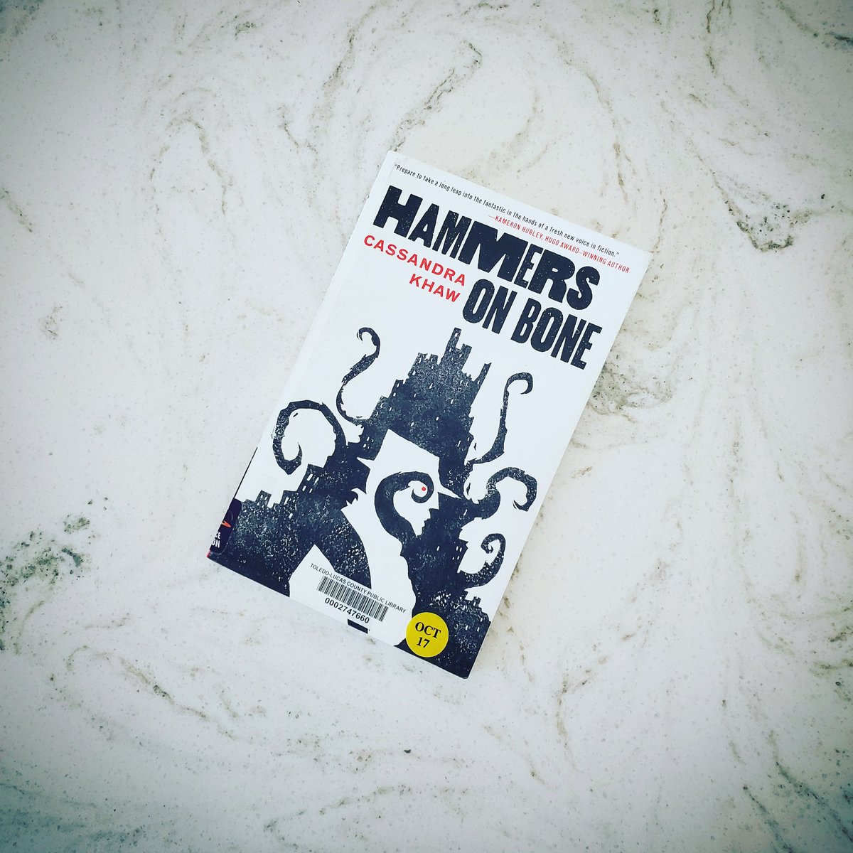 Hammers on Bone by Cassandra Khaw This little book packs a punch in just 72 pages. Think detective noir meets Lovecraft's The Call of Cthulhu. There's plenty of action and cosmic horror that'll keep you reading from cover to cover. This is the first in a two-book series!