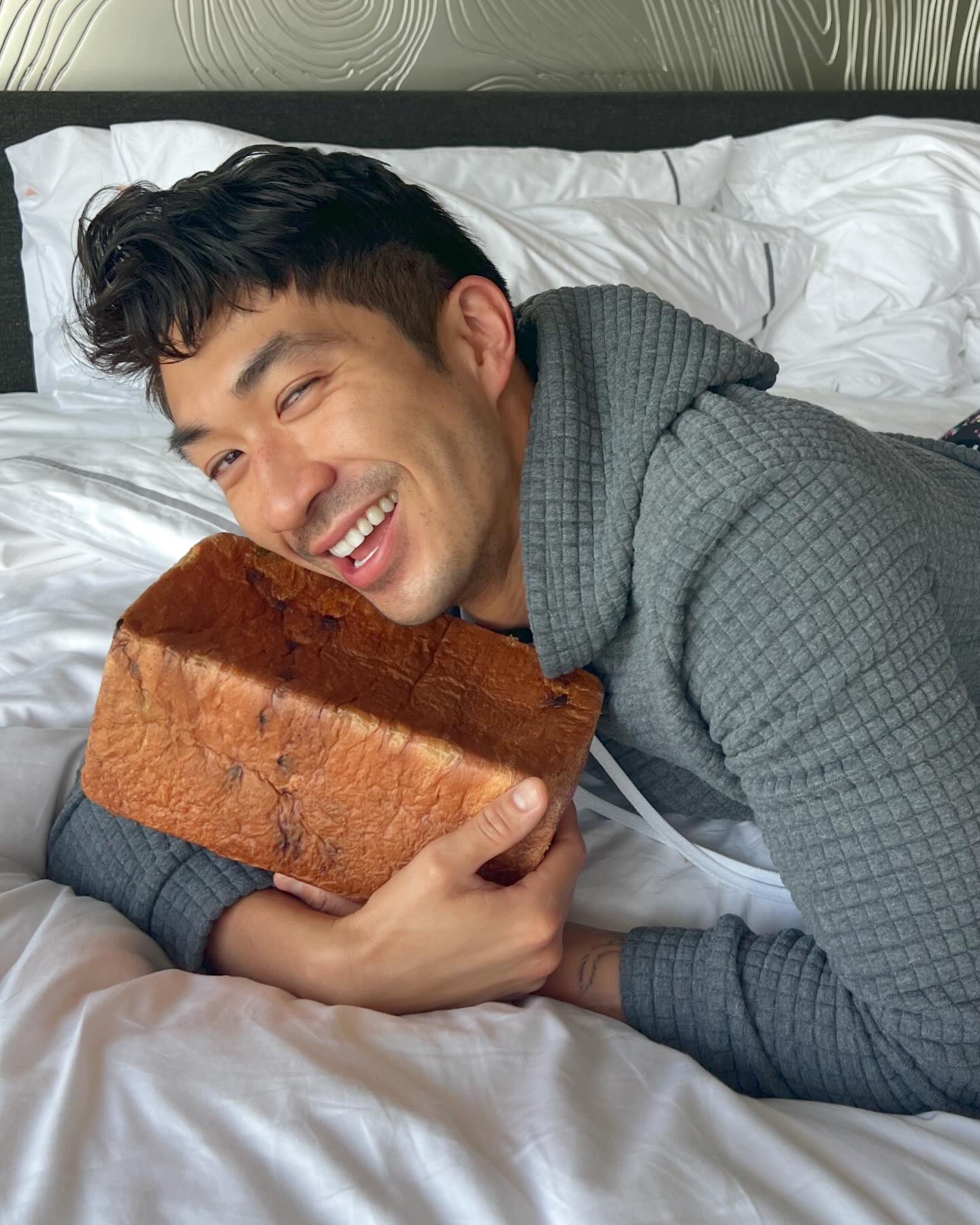 This pillow looks exactly like a loaf of bread and we need it