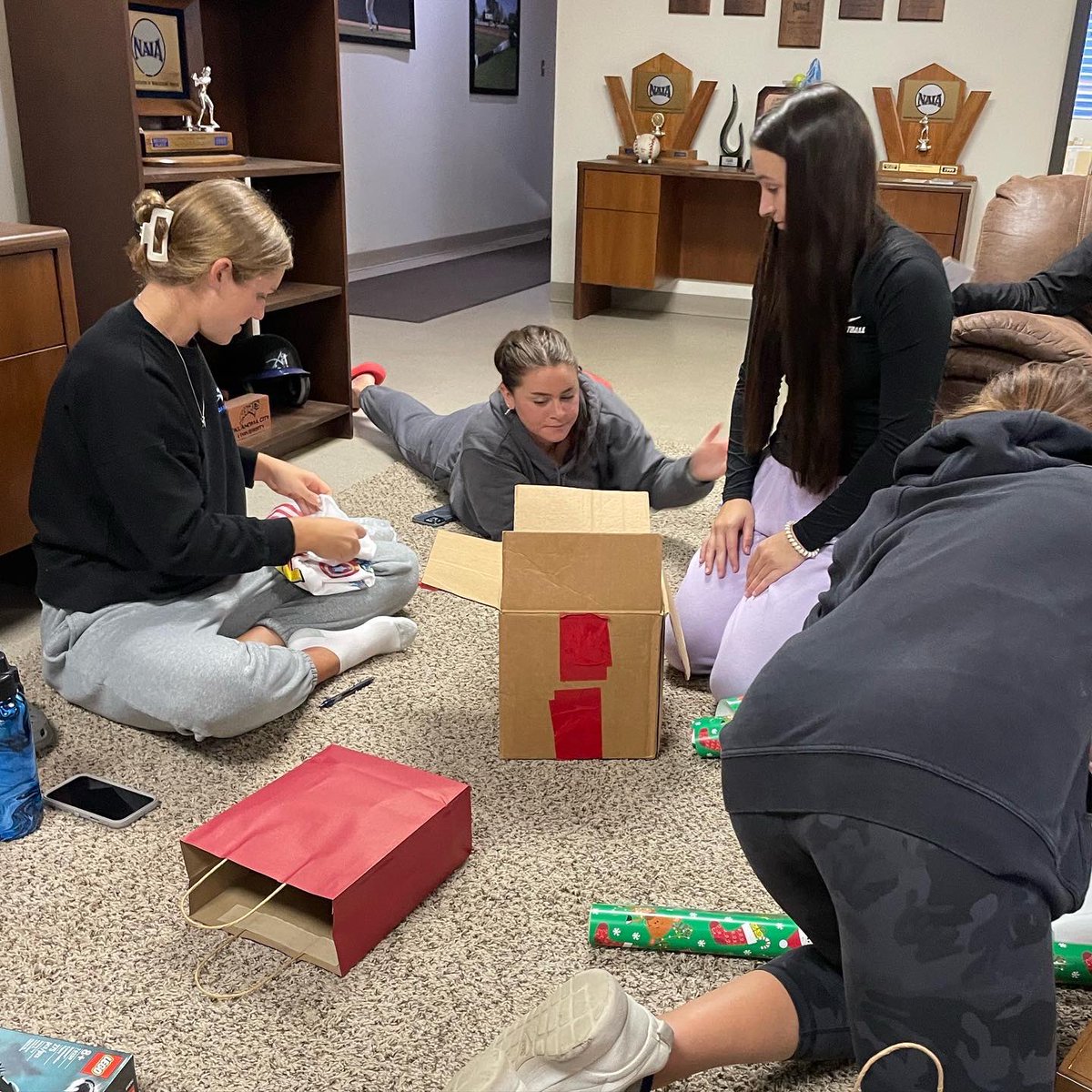 Happy holidays from our family to yours! This year we were lucky enough to get together & bless another family at our University. We had so much fun picking out presents and wrapping them before they went under the tree!