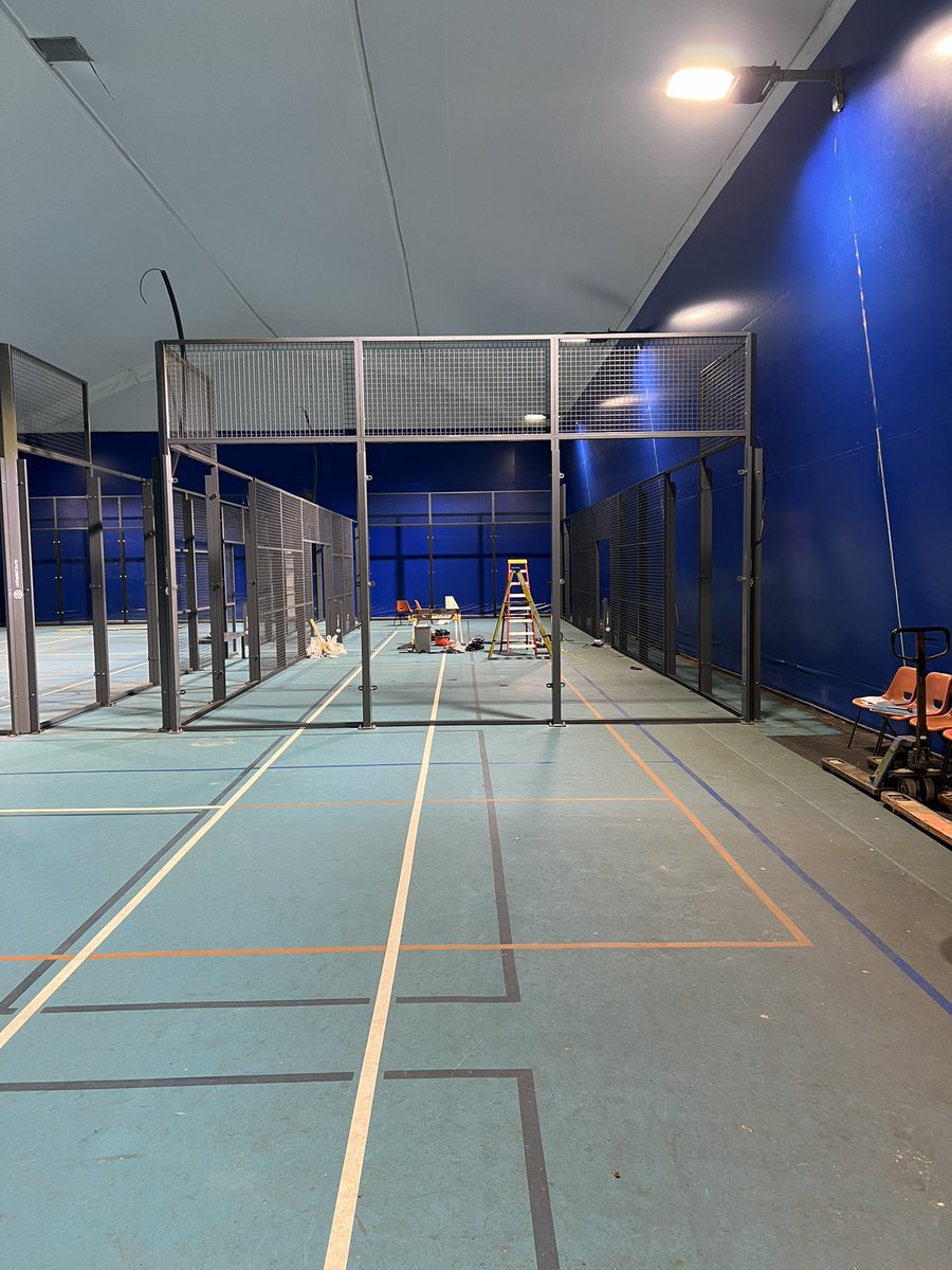 Day 2. The glass is going in and the single court frame is complete!