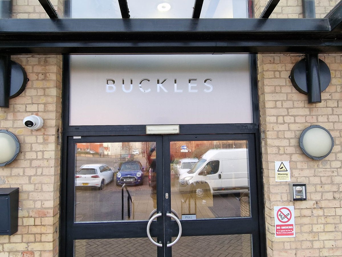 Frosted vinyl window sign for Buckles Law office entrance #windowgraphics