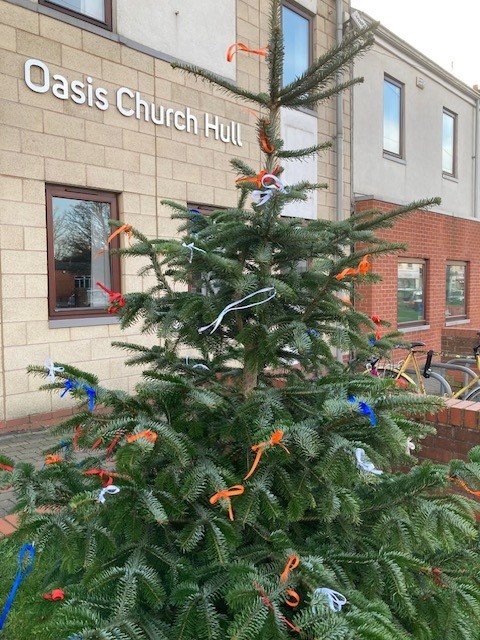 We've been hanging ribbons on our Christmas tree outside to take a moment to remember, reflect or lift a prayer to God. We know Christmas is difficult for many of us, with lots of sadness in the world. You are welcome to tie your own ribbon on our tree when you're passing.