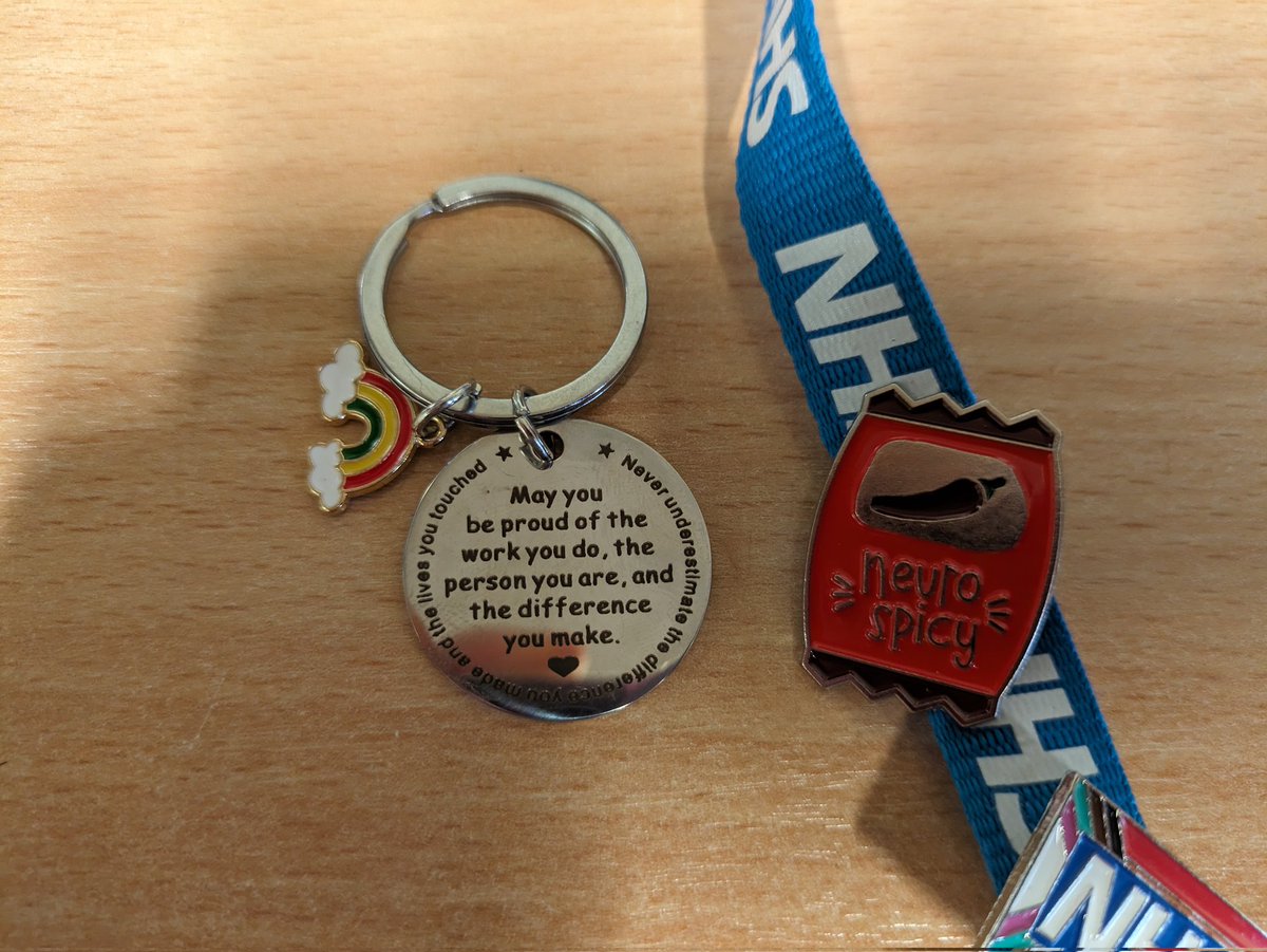 Secret Santa badge from a mystery colleague (who knows me well!) and a thoughtful keyring memento from an amazing student nurse 🩵 #happynurse