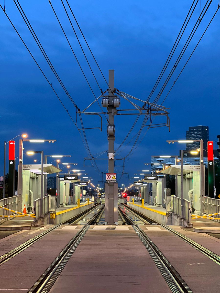 An early morning view captured at one of the above-ground stops in the east end. This stop recently had black and red TTC signage added on either side of the platform.