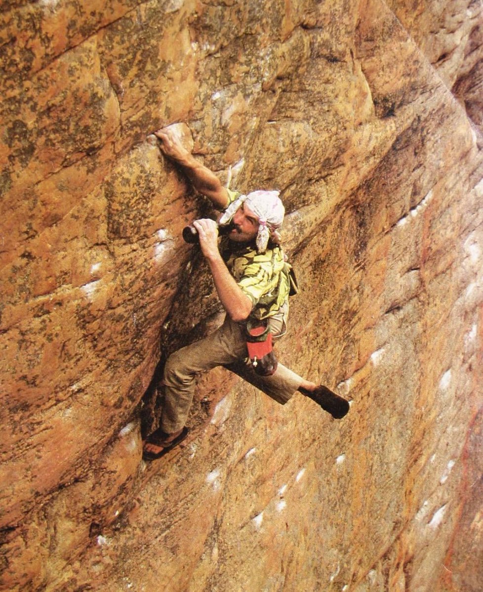 John 'The Vermin' Sherman climbing one handed with beer and flip flops. He is best known for pioneering the bouldering rating system in the early 90s.

Previously, boulderers used either the Yosemite Decimal System or John Gill's B-system, which was laid out in his 1969 American…