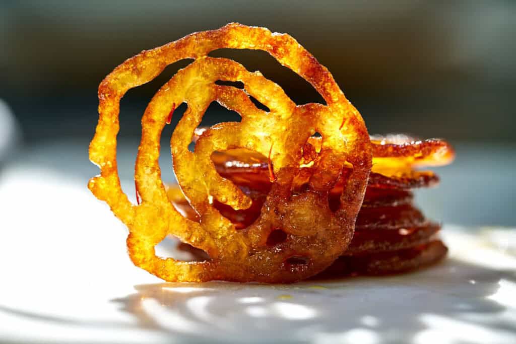 frolickinger's tweet image. i was recently in houston in an upscale middle eastern inspired grocery store where i came across this dessert “zulbia”. my mom commented how similar it looked and sounded to “jalebi”, an Indian dessert.