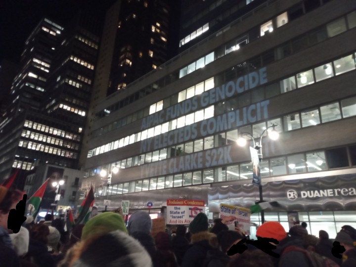 My rep <a href="/RepYvetteClarke/">Rep. Yvette D. Clarke</a> featured (along with other NY electeds) on this projection at the big unionized worker-led march for a ceasefire tonight. "Not another nickel, not another dime, no more money for Israel's crimes!"