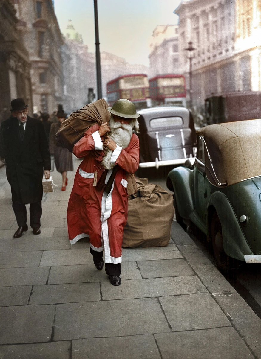 A British soldier dressed as Father Christmas on a London street in December 1940. #santa #fatherchristmas #thefoties #the40s #ww2 #wwII
