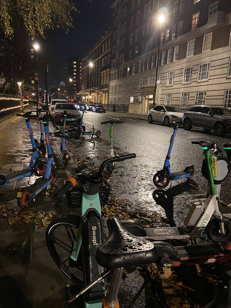 MaryleboneMums's tweet photo. Yet again 2 resident parking bays strewn with rental bikes and scooters north side of Portman Sq. What action is being taken to prevent and penalise this? It is impacting residents daily lives @PDimoldenberg @barbararesearch @MaryleboneAssoc https://t.co/oS8s9Crh2V