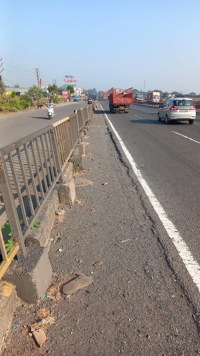 Pathrudkar's tweet photo. @NHAI_Official @nitin_gadkari mumbai ahemadabad highway is not safe for cyclist. Side strips are very narrow and the the road is not clean. Lot of sand and stones and unwanted material lying. https://t.co/zssvBF8g7o