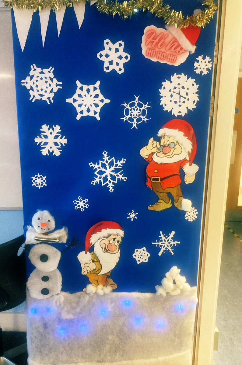 Christmas door decor. Hi - ho ho ho. Rotational and line symmetry snowflakes ❄️❄️. Well done to S3 for designing and putting it together 🎉🎄🎅🏼