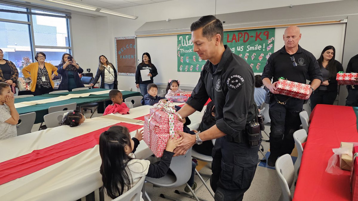 LAPD K9 officers visited Ninth Street Elementary School this morning for a special toy giveaway. These officers distributed holiday cheer and brought smiles to the faces of excited children as they each unwrapped gifts.