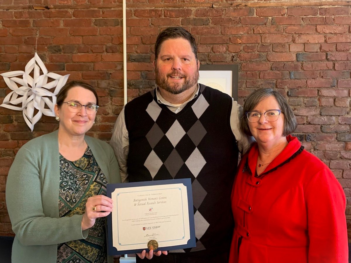 Congratulations to @awrcsasa_ on 40 years of dedicated service across Antigonish and Guysborough counties. Pictured: Coady Staff Brian Lazzuri (centre) presents a certificate acknowledging AWRCSASA's 40th anniversary to the centre's Anita Stewart (left) and Vangie Babin (right).