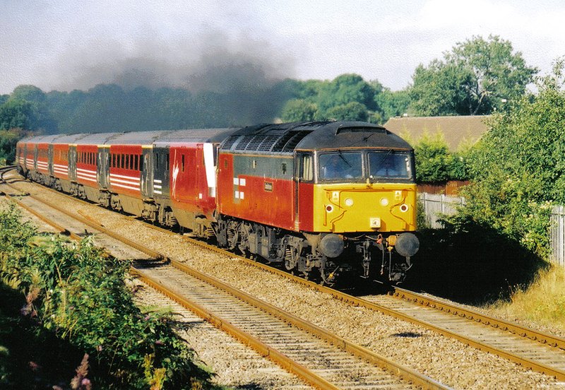 One of the many weekends drags during 2003 , this one with 47789 passing Stockingford on its way down to Nuneaton station . Actual date unknown. 
@NuneatonRailway #class47