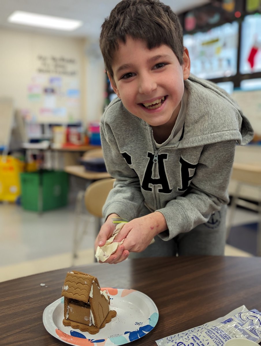 Today for Gingerbread House Day we built and decorated gingerbread houses! #pawsome58 #dg58pride