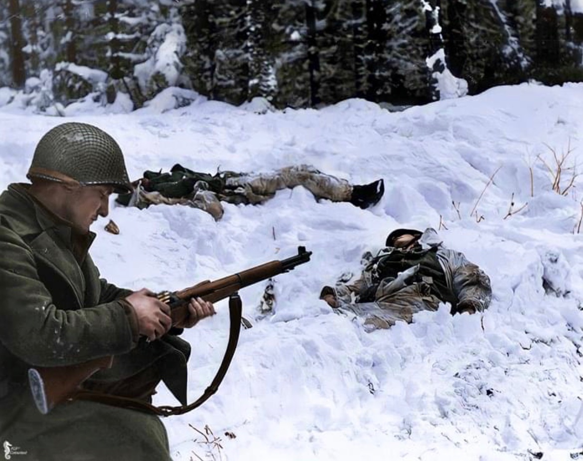 Jason_R_Burt's tweet photo. During the Battle of the Bulge, Pfc. Frank Vukasin of the 83rd Infantry Division reloads his rifle on the front lines near Houffalize, Belgium. 🪖 https://t.co/nvyUDiURea