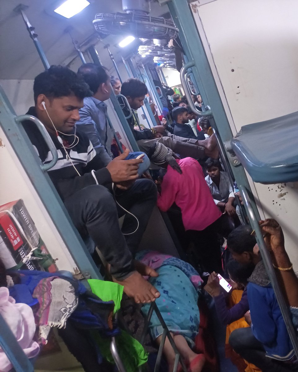 twitereply's tweet photo. This is the scene of train no. 12834 howrah to Ahmedabad. This is the scene of sleeper class not the general. Why TC allowed general class public on sleeper class. @IRCTCofficial @RailMinIndia @RailwaySeva 

We are feeling very uncomfortable when we have confirmed ticket. https://t.co/AJt1XZZ5JG