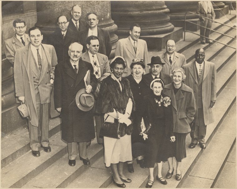 A pre-festive tribute will take place 11am on Monday 18th December, to Ms Claudia Jones (2nd row, 1st from left) outside the iconic Camden house where she lived and passed away in. She will be honoured with the UK's last blue plaque for 2023 at 58 Lisburne Road, London, NW3 2NR