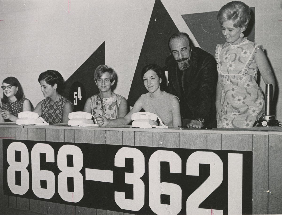 Wednesday is for WQLN- ETV! 📻 

Mitch Miller, celebrity auctioneer at the 1st annual WQLN-ETV auction held August '69. He is pictured discussing the opening night's procedures with Mercyhurst students- auction aides, on his left: Ruthann Guzy & on his right: Margaret Kloecker.