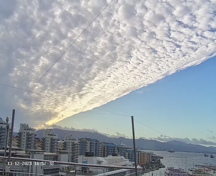 #Gibraltar - 4:50pm, 13/12 - that wonderful cloud clearance caught by the MeteoGib Webcam and approaching from the NW - this evening, clearer skies moving in with a breezy West to Northwesterly easing overnight - and it's a duvet night with temperatures dipping to 10C.